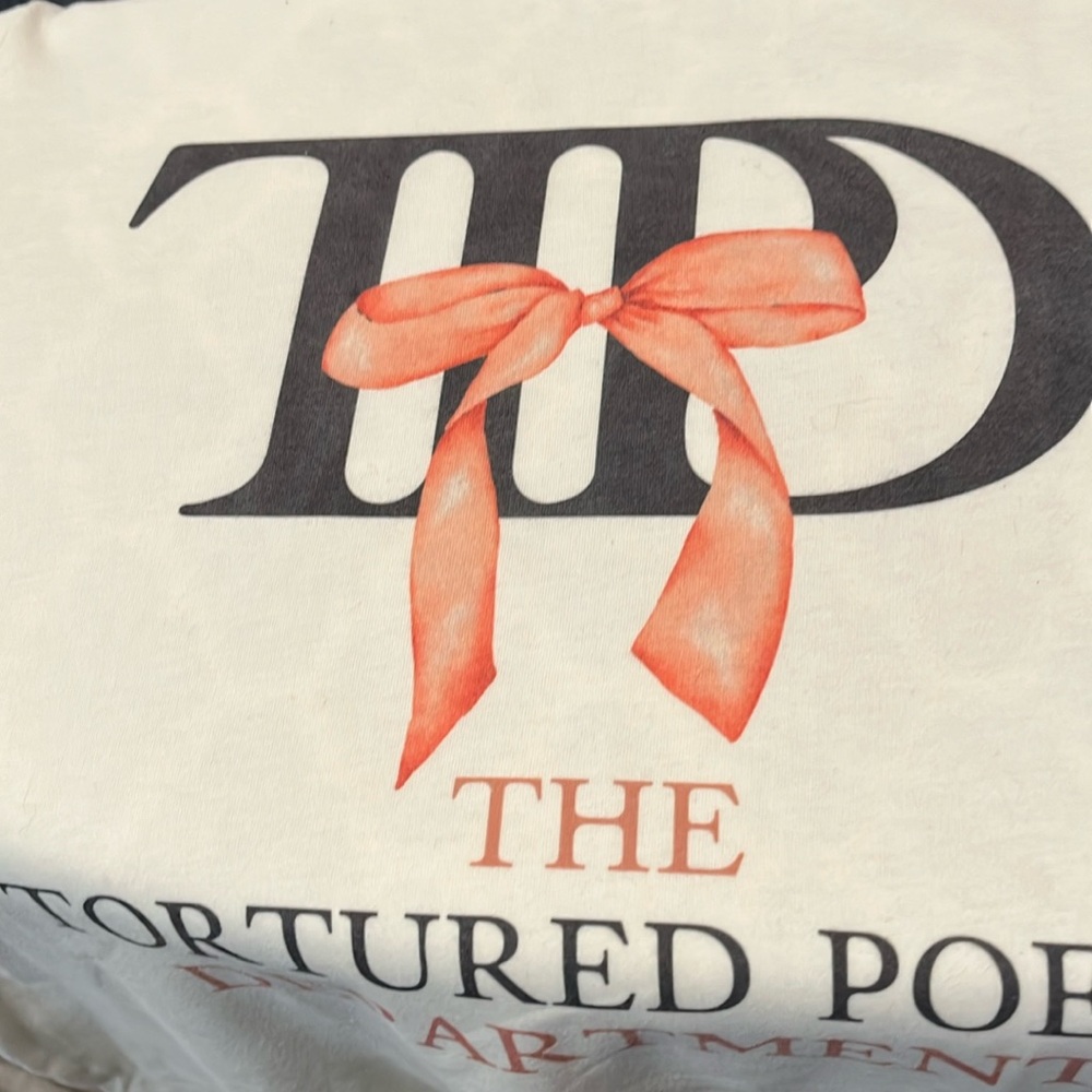 Taylor Swift T-shirt The Tortured Pet Department in cream color. Sz Lg.